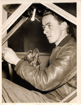 Bud in cockpit with Pupsy